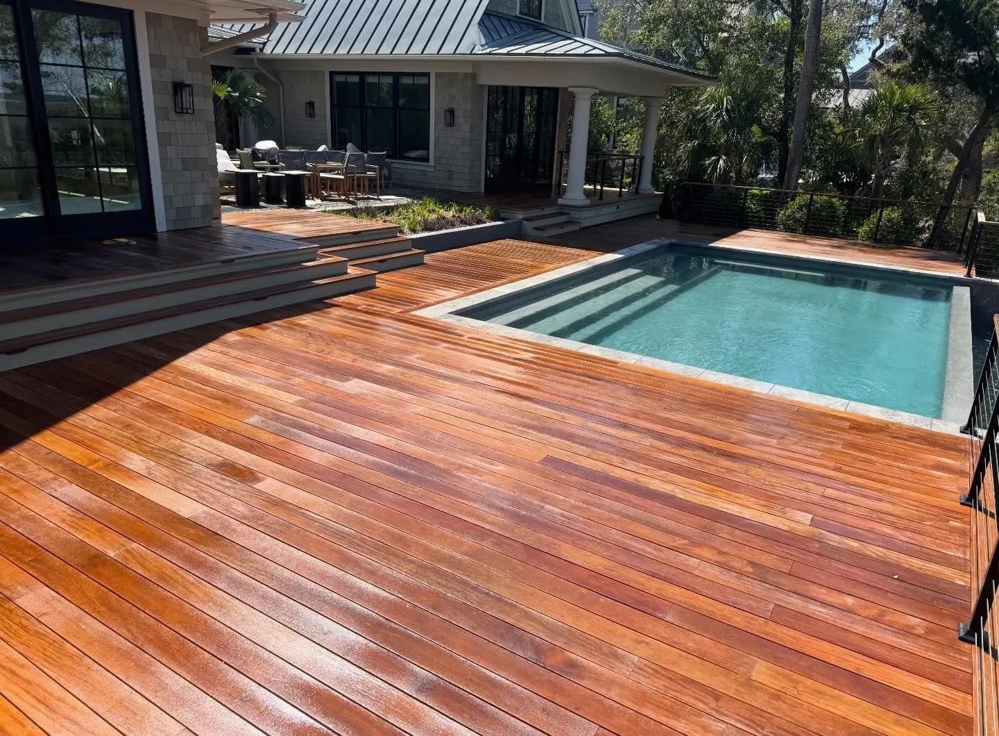 Restored Kiawah Island IPE pool deck glowing warm brown after cleaning and brightening