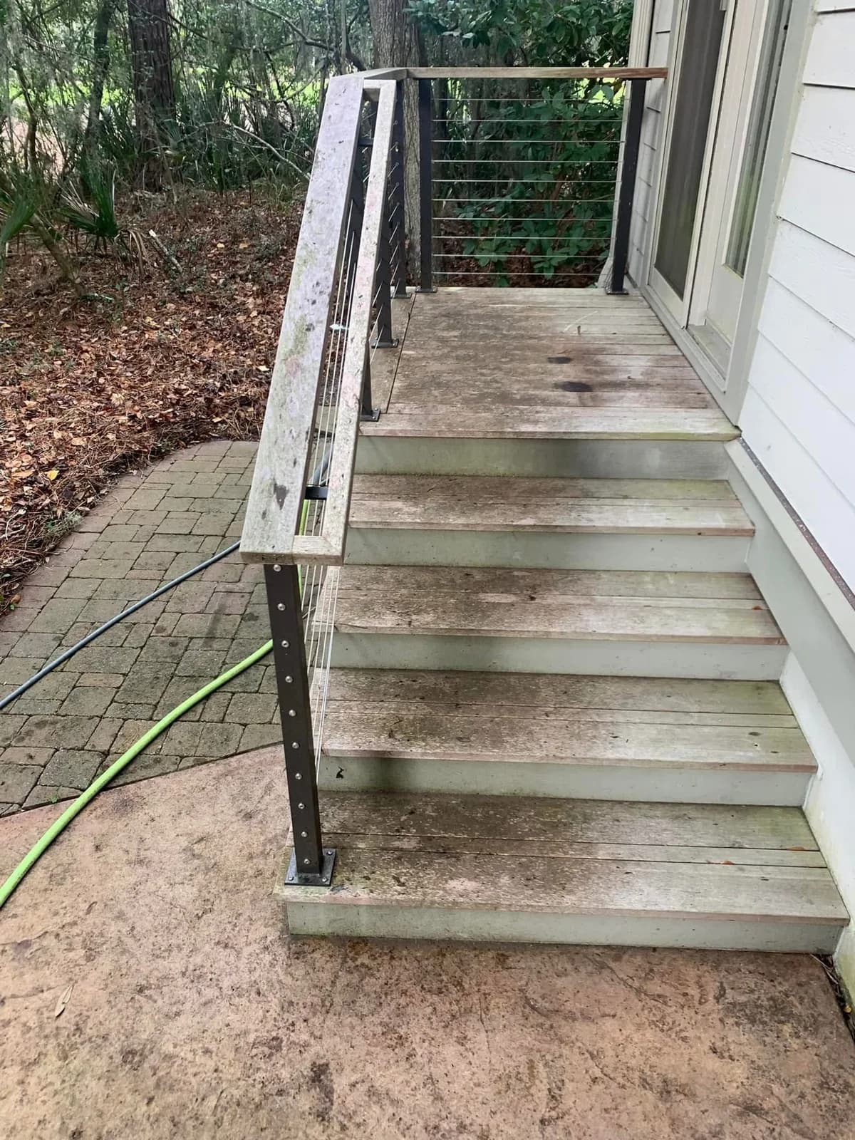 Wooden porch steps gray and dirty before cleaning and restoration