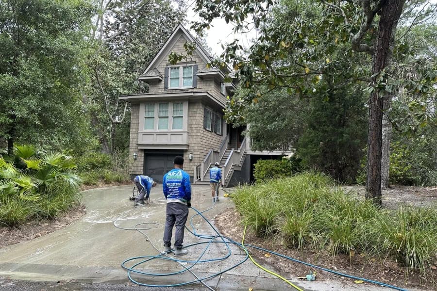 Peppers crew pressure washing a Charleston home exterior
