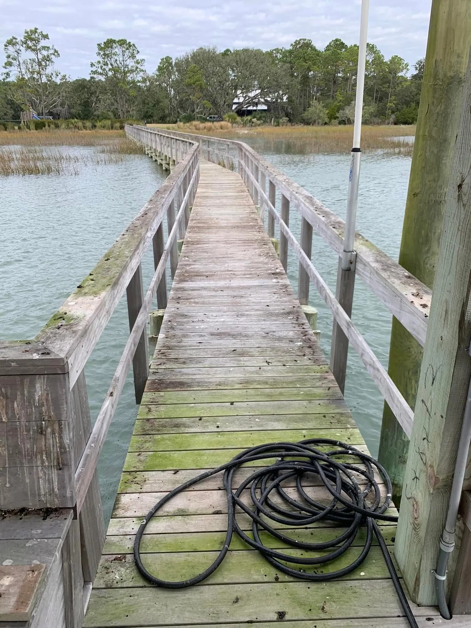 Seabrook Island private dock with algae stripped and restored wood color after professional dock pressure washing by Pepper's Pressure Washing