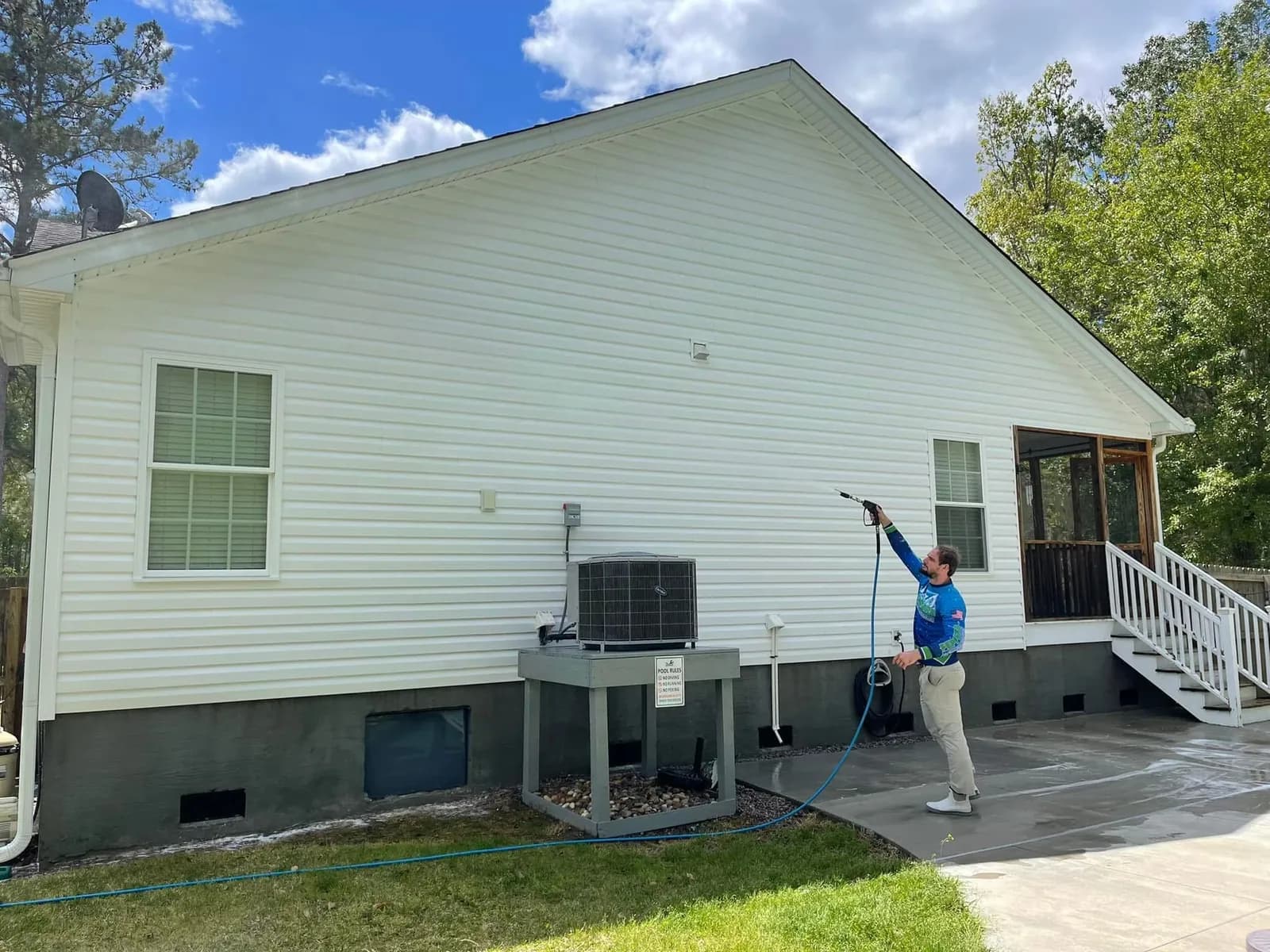 Summerville home siding restored to uniform clean color after professional house washing by Pepper's Pressure Washing