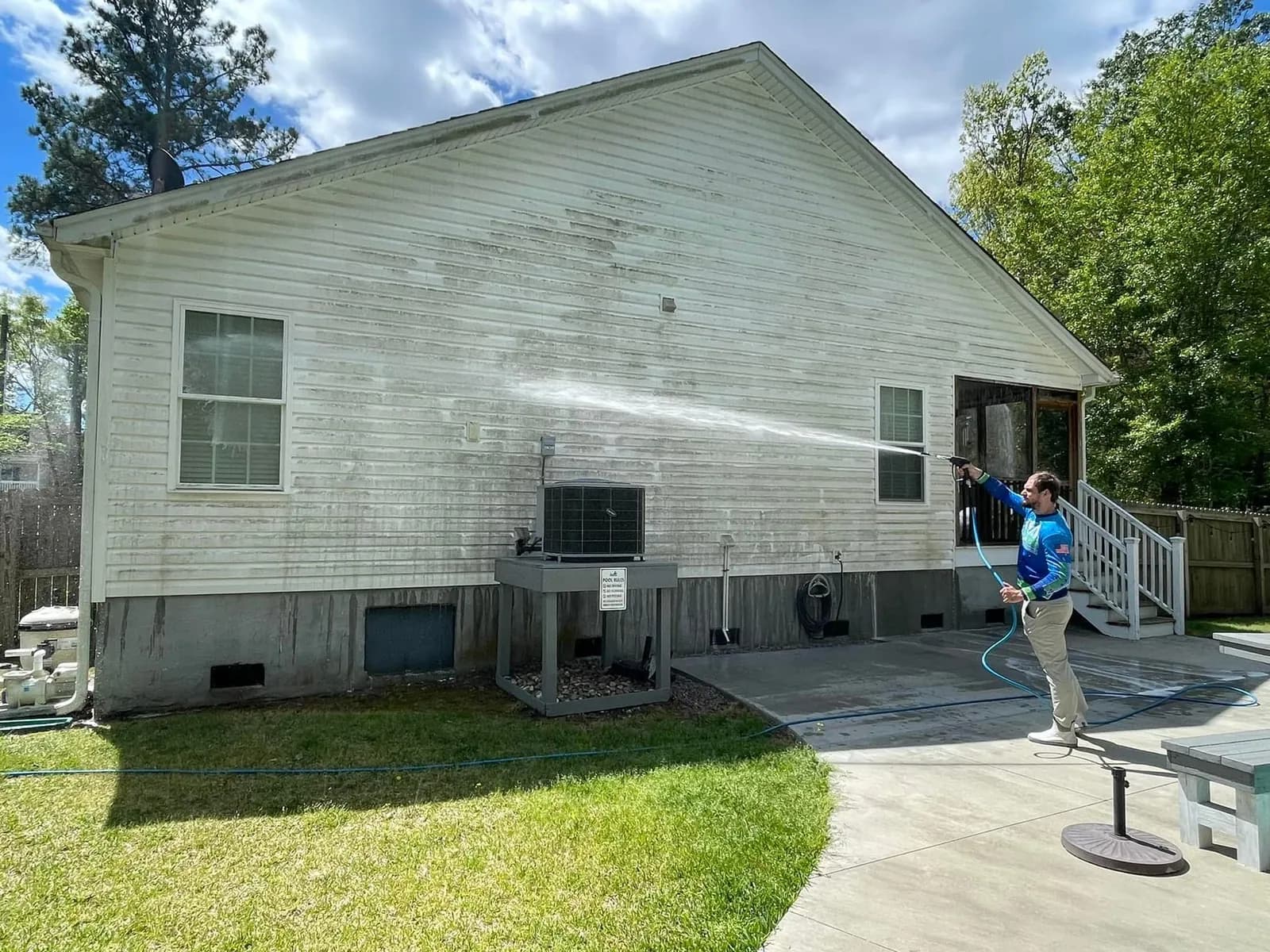 Summerville home siding with shaded-wall mildew and tree-canopy debris before professional house washing by Pepper's Pressure Washing