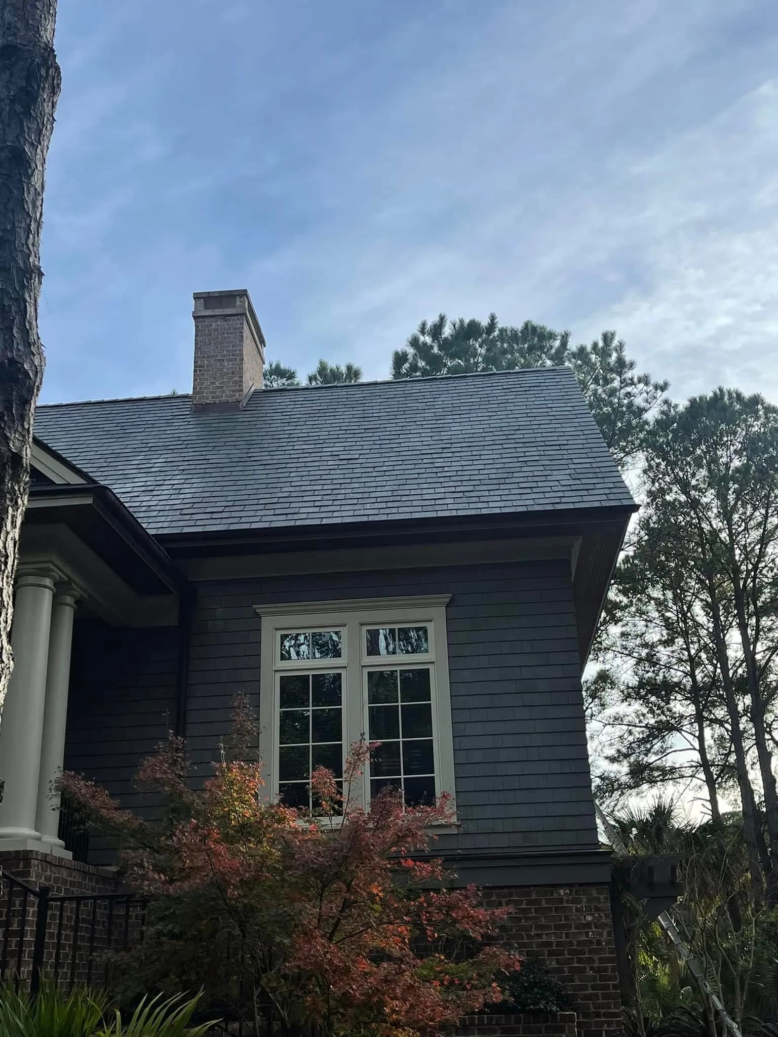Charleston slate roof with algae stains lifted and restored slate color after professional slate roof soft-wash by Pepper's Pressure Washing