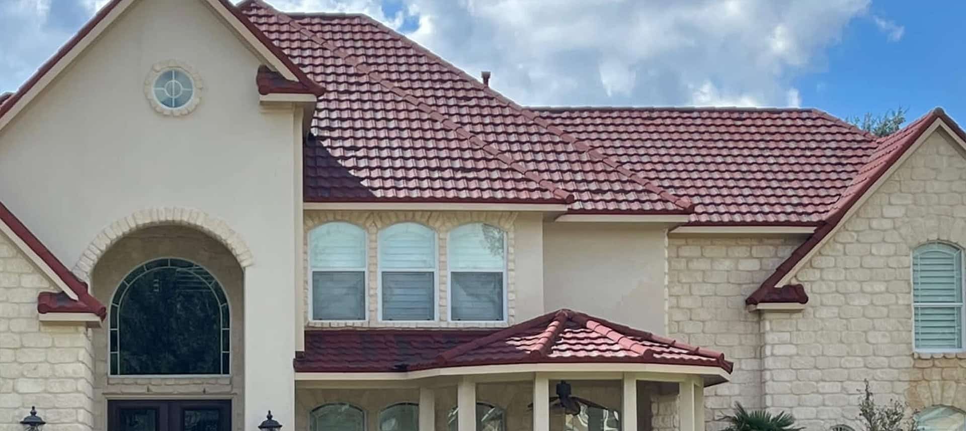 Peppers crew soft washing dark algae streaks off a Charleston roof — before and after results