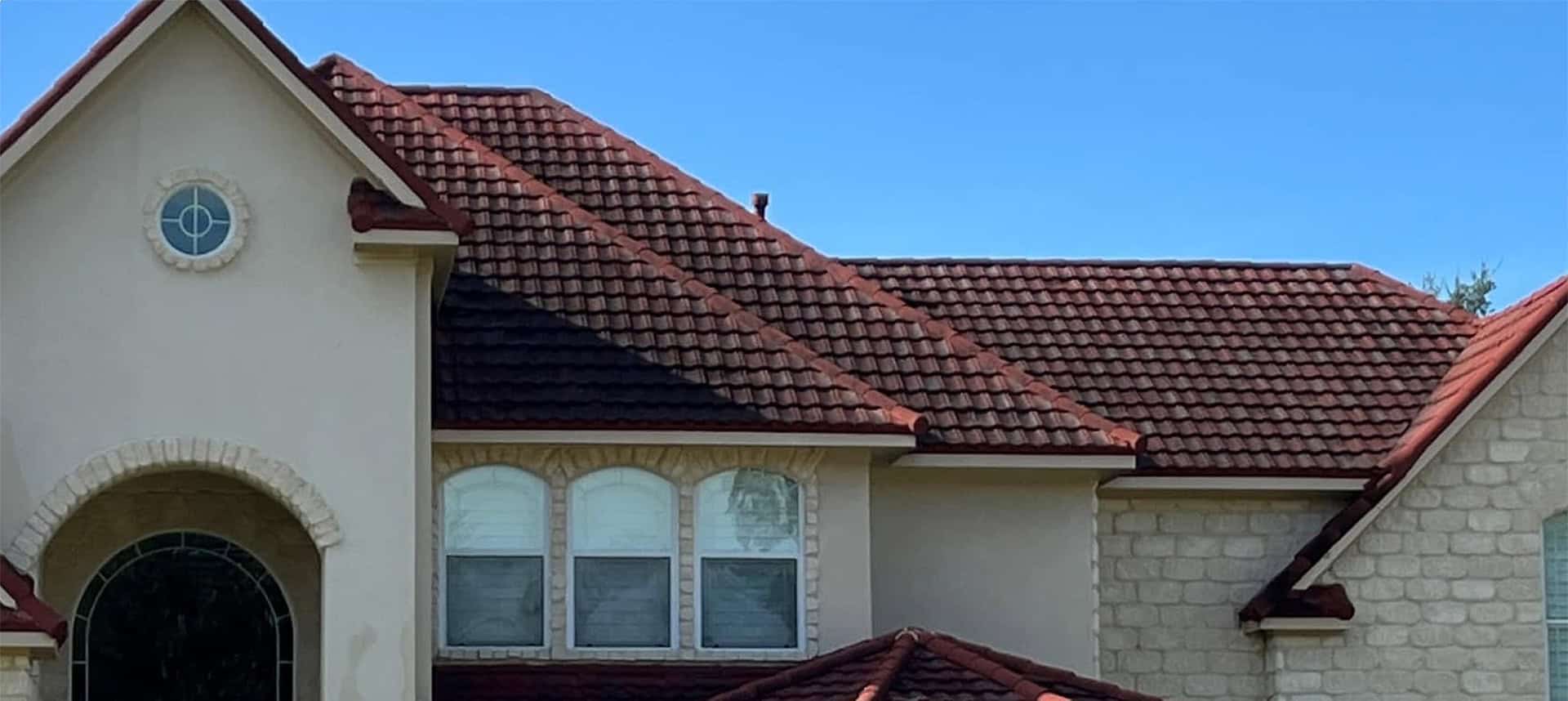 Peppers crew soft washing dark algae streaks off a Charleston roof — before and after results