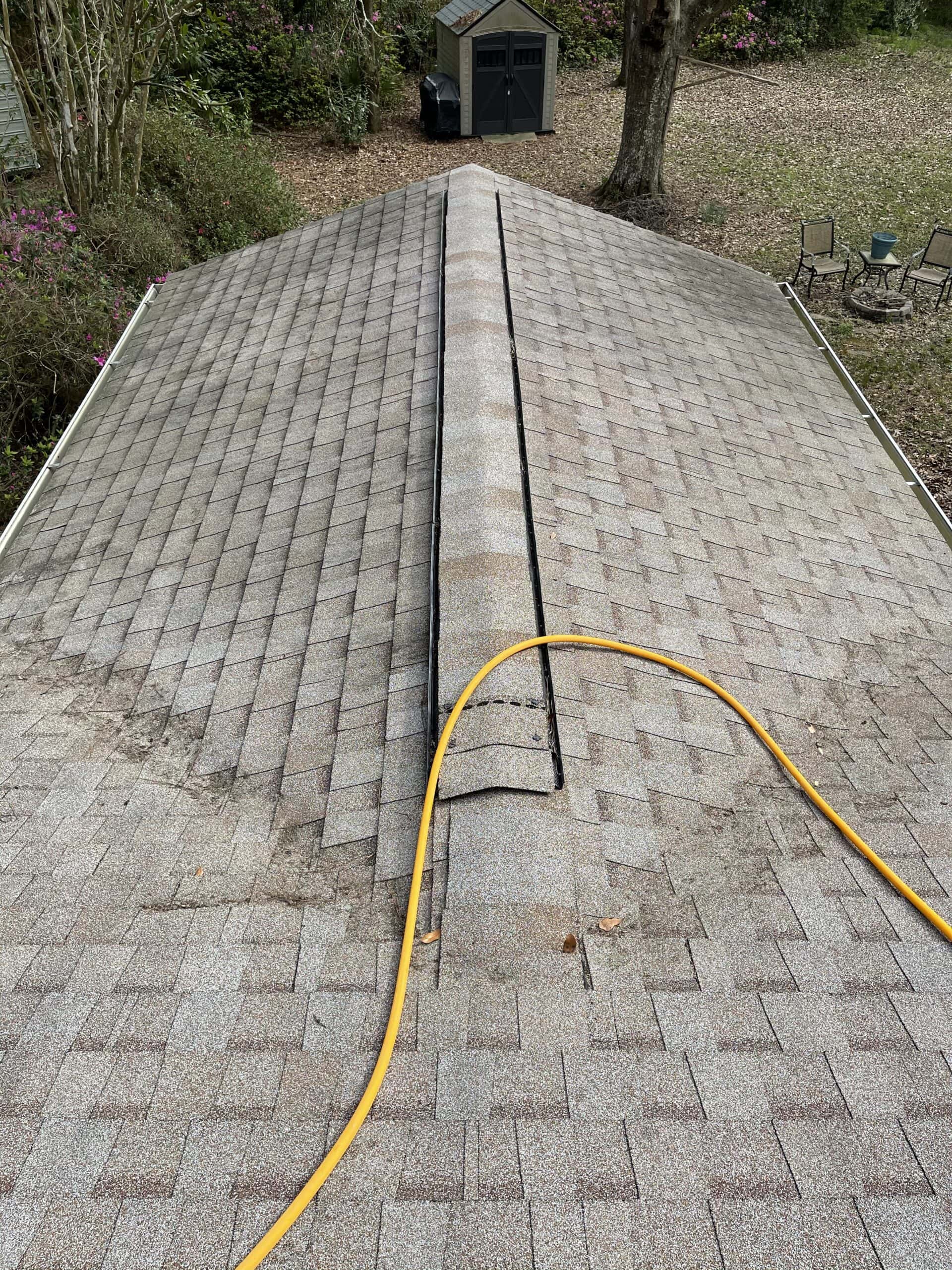 Charleston roof with heavy moss and staining before soft wash treatment